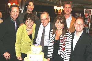 Color Purple celebrates 6 months - producers around cake 